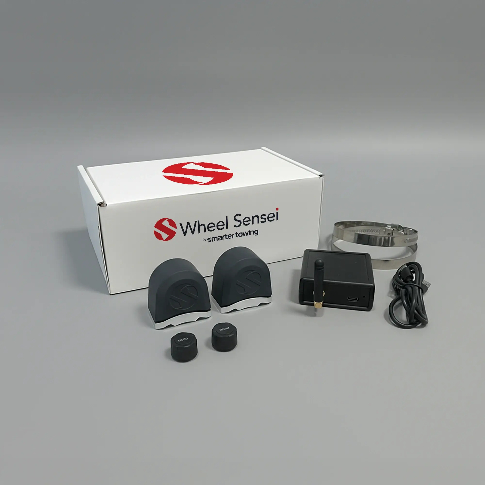 Single Axle TPMS Bundle by Smarter Towing — includes 2 x wheel sensei sensor units, 2 x pressure sensors, ring clamps, data box, USB-C cable and activation code for real-time tyre pressure and bearing monitoring on trailers and caravans.