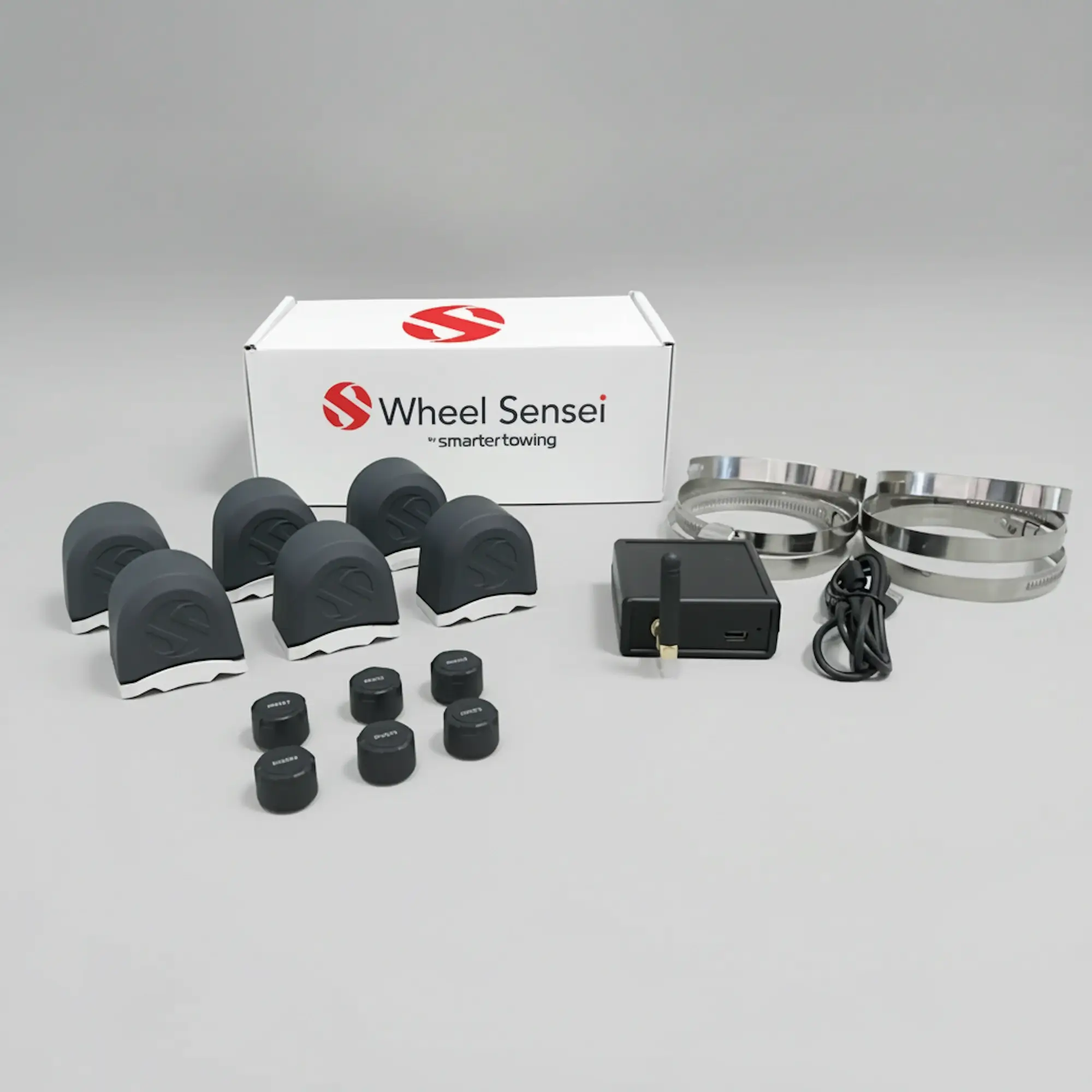 Triple Axle TPMS Bundle by Smarter Towing — includes 6 x wheel sensei sensor units, ring clamps, data box, USB-C cable and activation code for real-time tyre pressure and bearing monitoring on trailers and caravans.