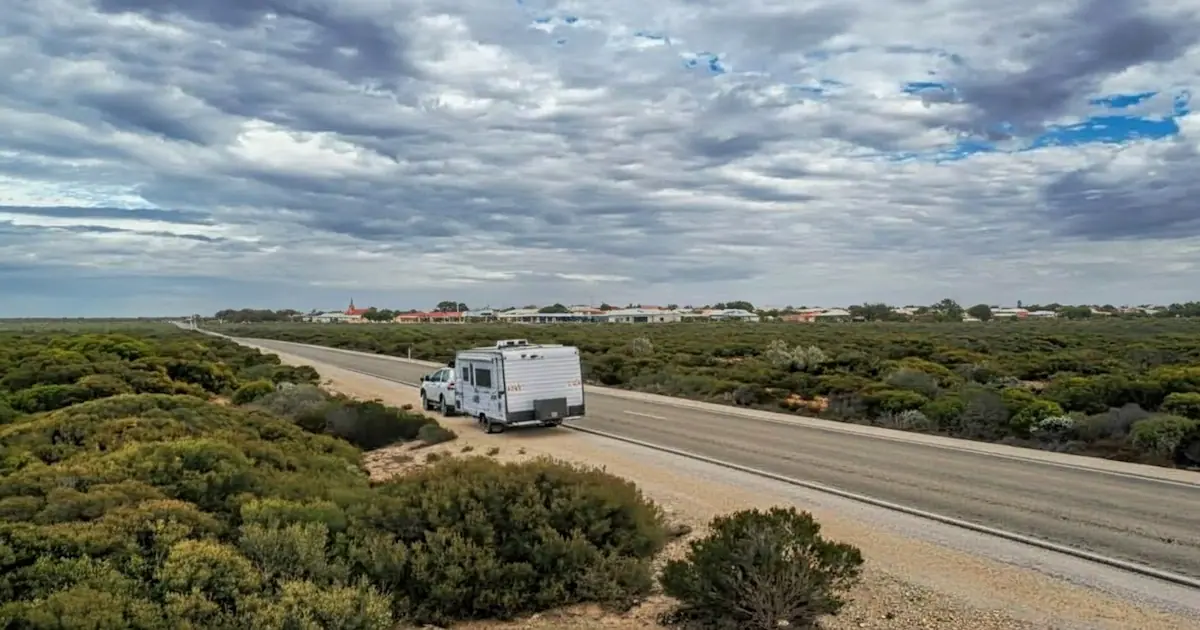 Caravan being towed on an open road highlighting the importance of wheel bearings for towing safety
